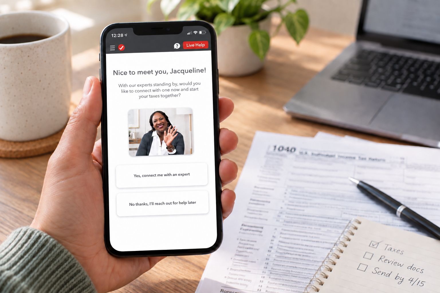 Customer holding a phone with a named TurboTax Live expert visible in the experience